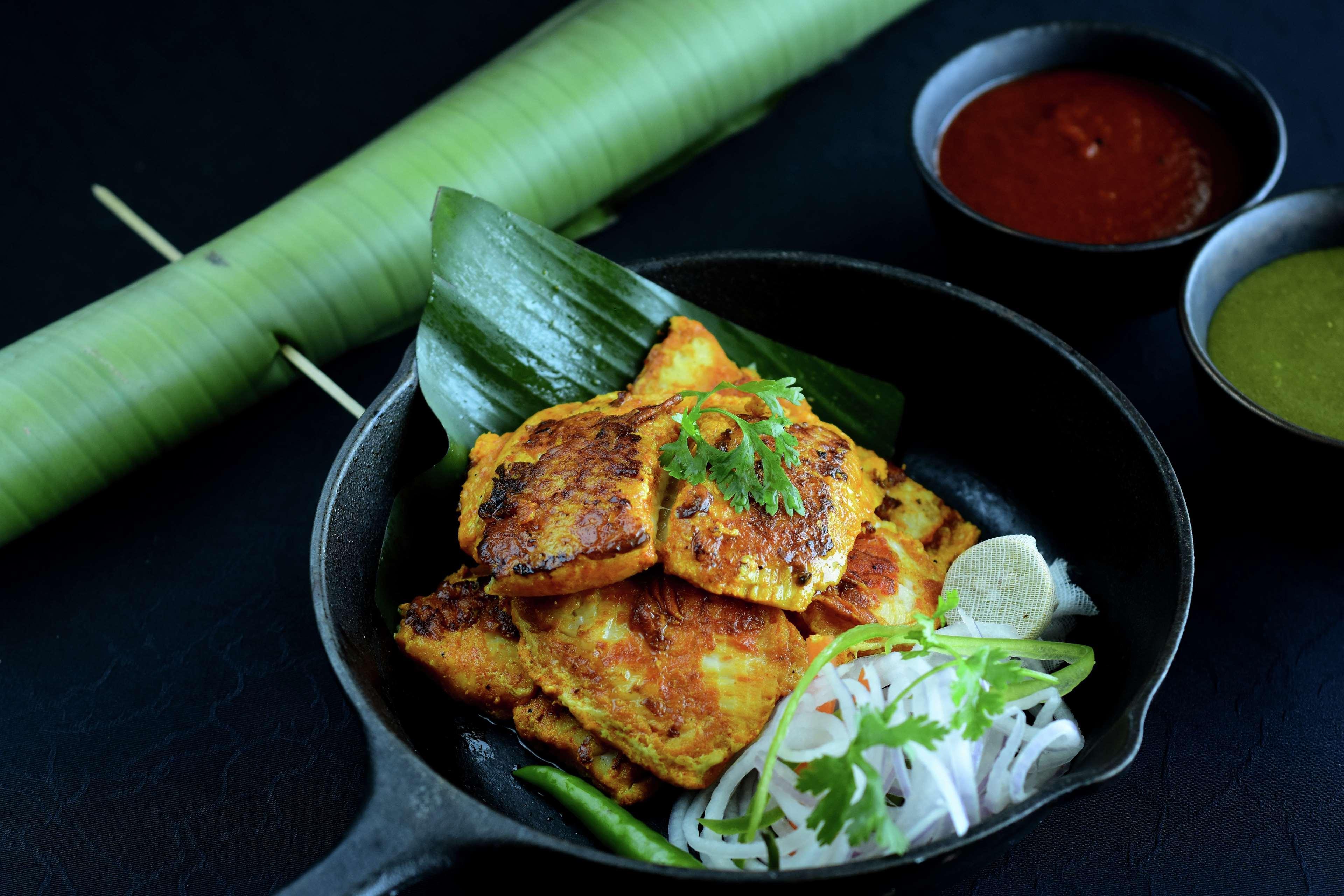 Hilton Mumbai International Airport Hotel Exteriör bild A plate of opek